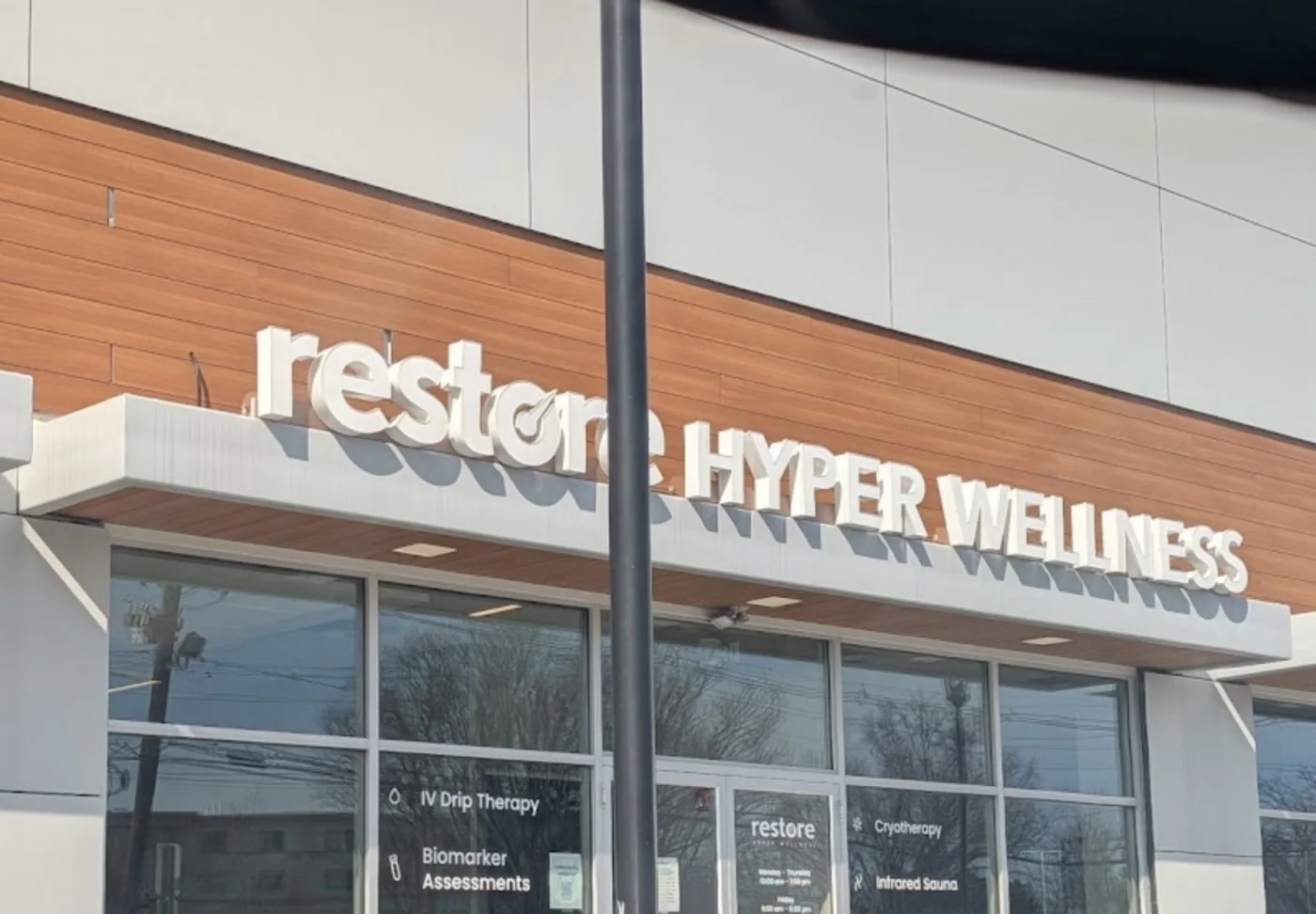 Restore Hyper Wellness storefront in a retail centre with illuminated channel-letter signage